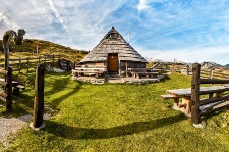 Mountain cottage hut or house on idyllic hill Velika Planina. Bio Eco farming healthy life