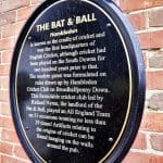 A plaque on the outside of the Bat and Ball