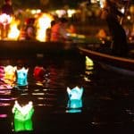 Paper lanterns float in the river