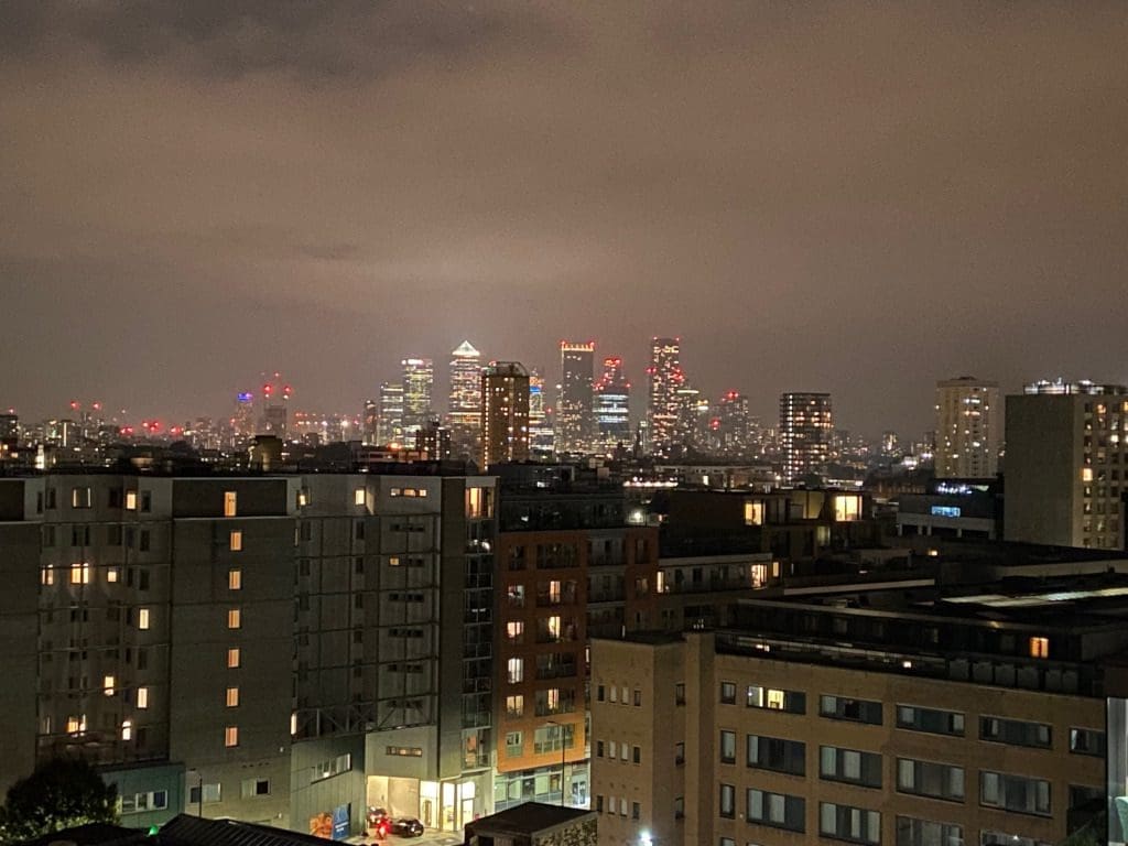 Camary Wharf appearing from the night sky