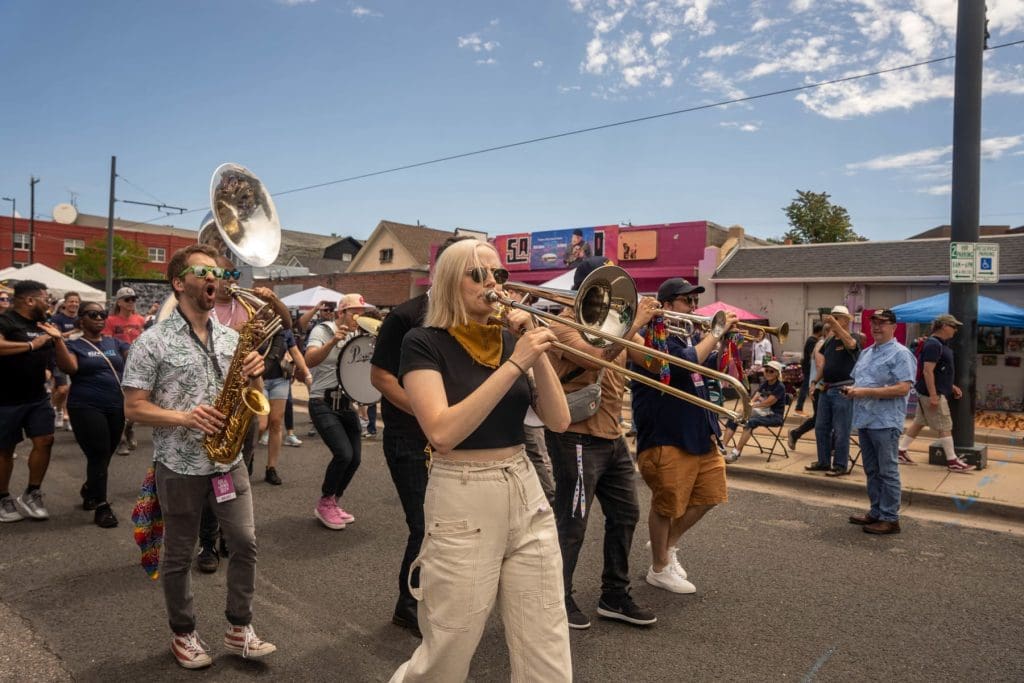 Guerilla Fanfare Brass Band 2, parade, 2023 Five Points Jazz Festival, photo by Kaitlin Bouzek