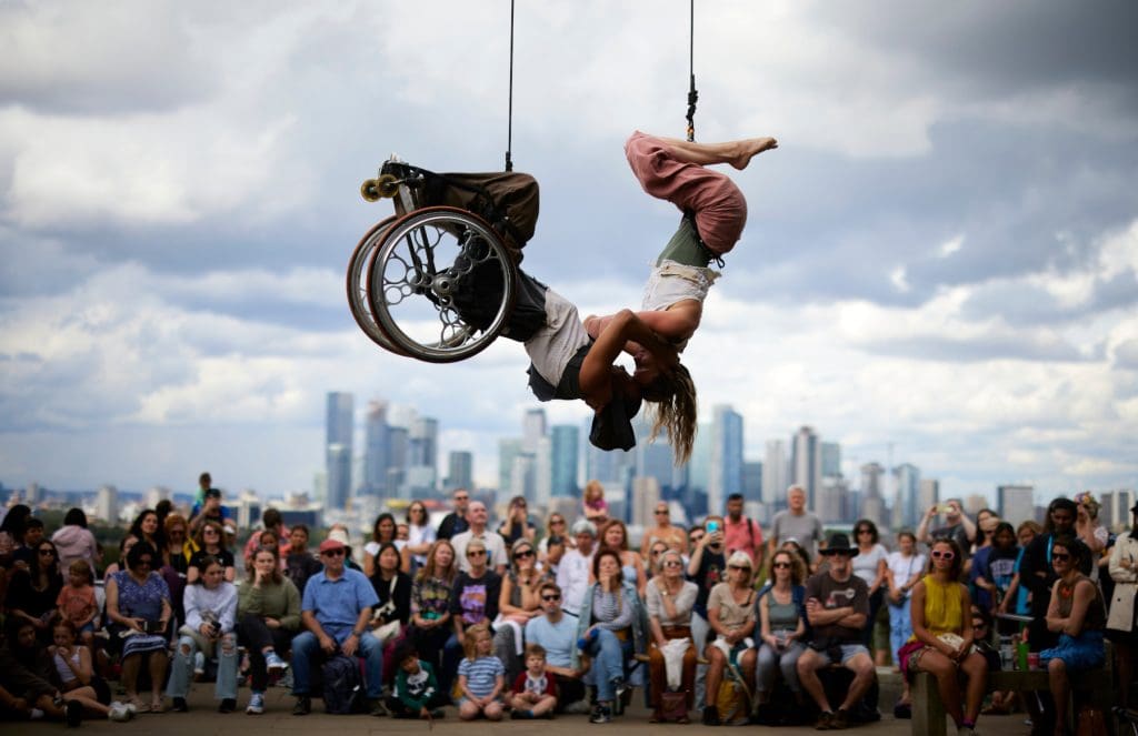 Greenwich + Docklands International Festival's 'The Air Between Us' performed by wheelchair user Rodney Bell and Chloe Loftus at the top of Greenwich Park. Photograph by David Levene 26/8/23