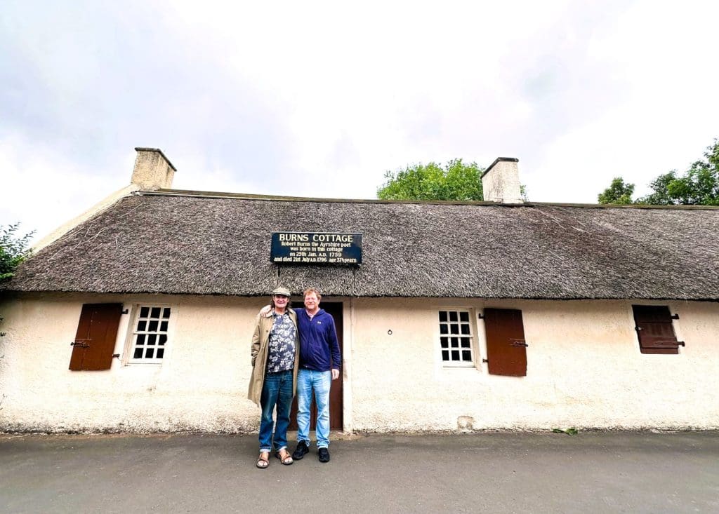 Mark standing next to Boon outside of Robbie Burns' house, photo by George McGeorge