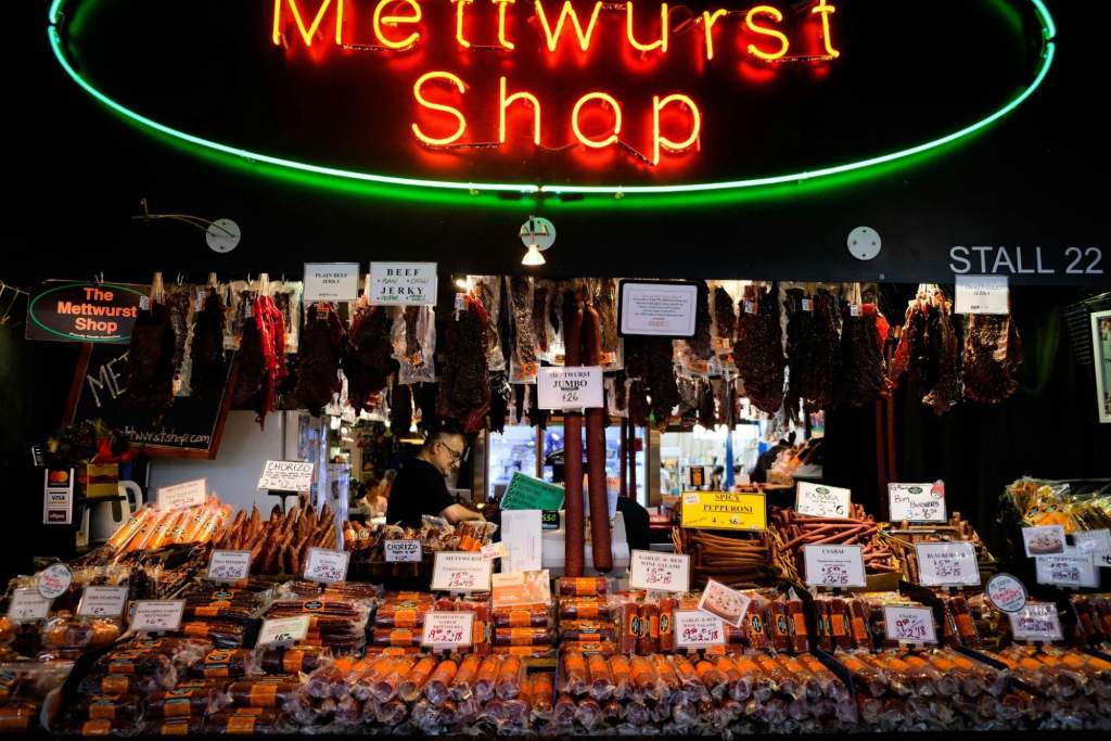 https://unsplash.com/photos/a-store-with-a-neon-sign-that-says-mettwurst-shop-HU4O1t0xs_I