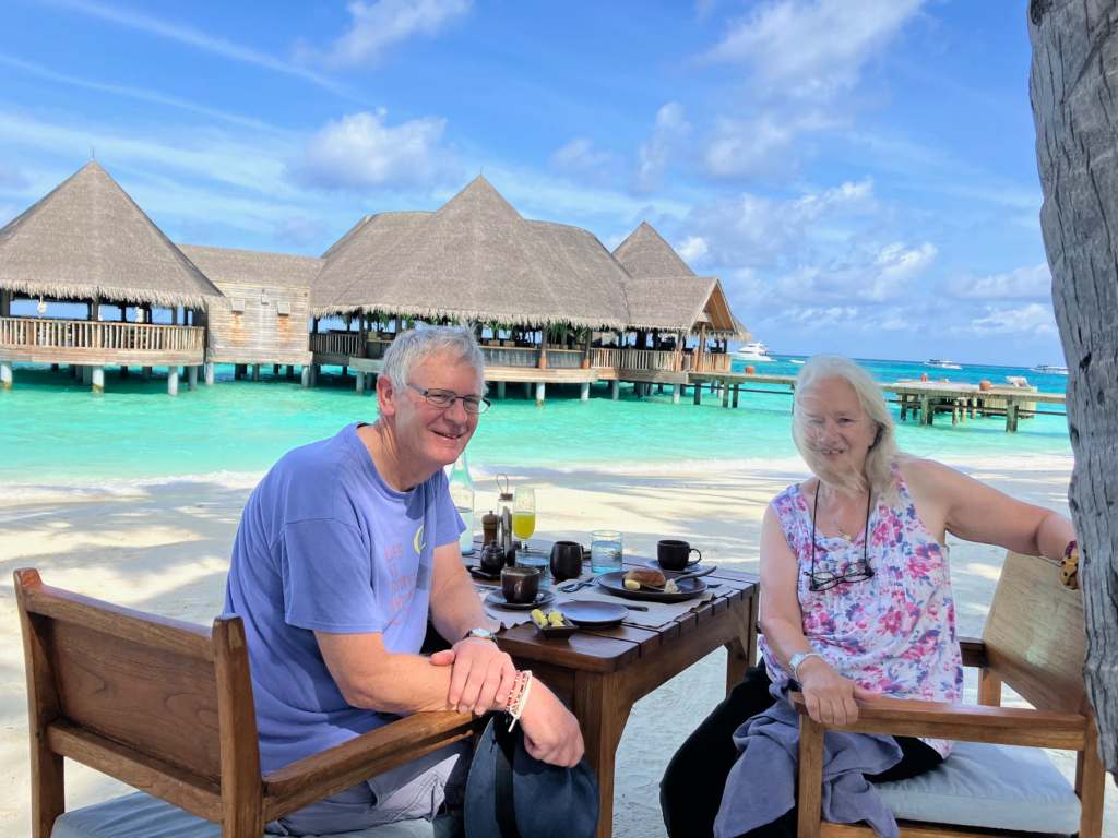 Roger and Eileen enjoying their breakfast in paradise