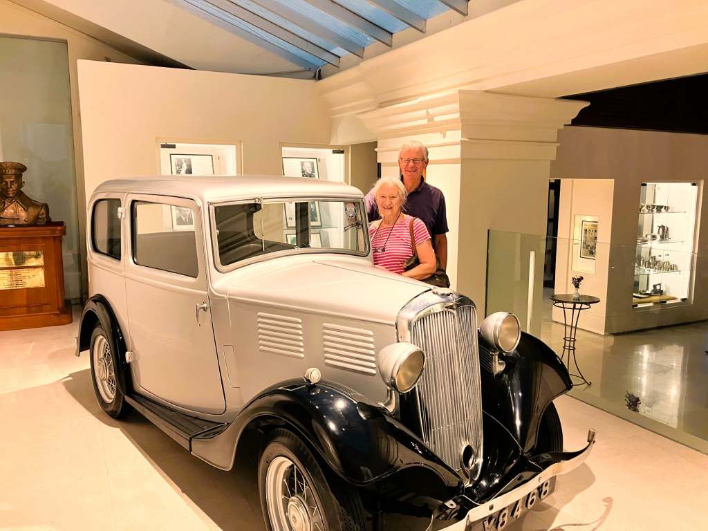 Roger and Eileen beside the first ever car bought by Prince Philip